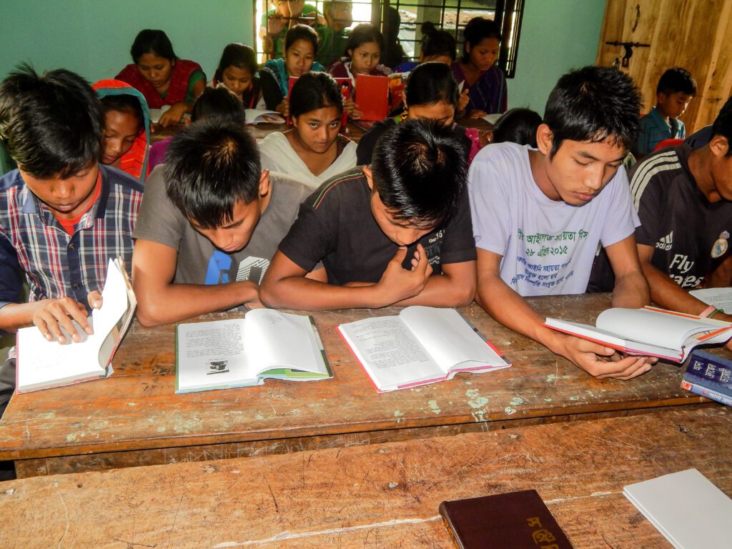 Children of the Hills Students studying books