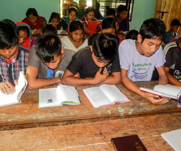 Children of the Hills Students studying books